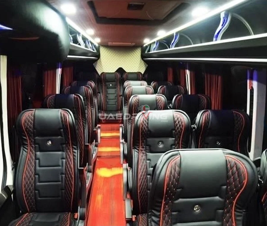 Interior of Mercedes Sprinter 19 Seater showcasing sleek black leather seats, emphasizing the elegant and sophisticated design