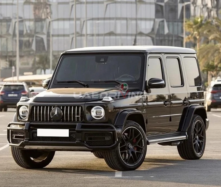 Front view of a black Mercedes Benz G 63 car with a bold and stylish appearance