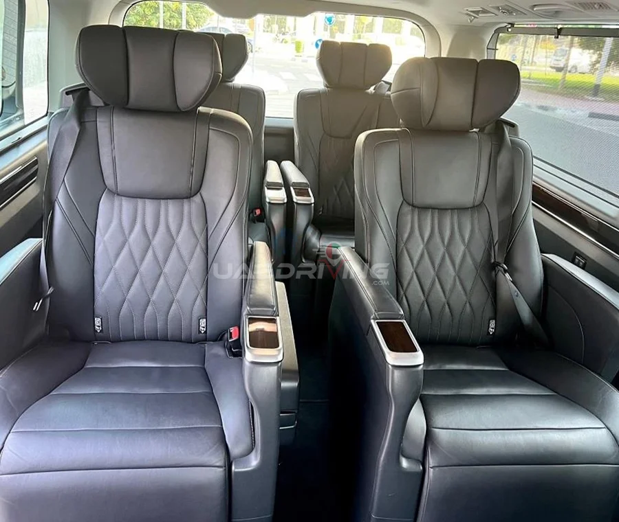 Interior of Toyota Granvia featuring exquisite leather seating and sophisticated interior detailing.