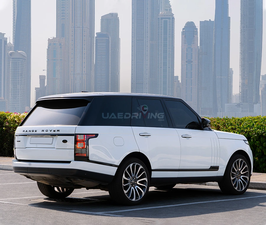 Side view of a white Range rover Vogue showcasing its cutting-edge features and refined style.