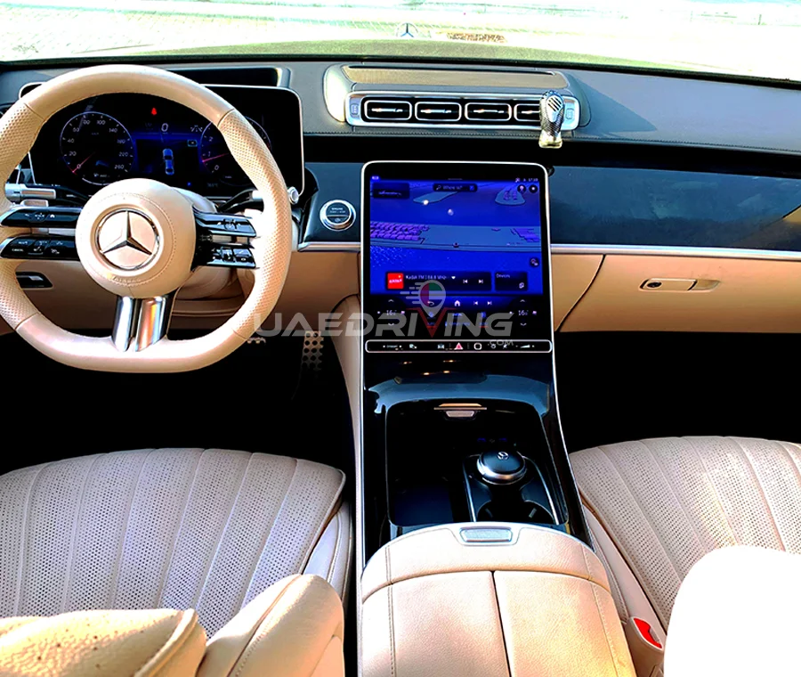 Luxurious interior of a Mercedes S-Class car showcasing premium leather seats, sleek dashboard, and advanced infotainment system