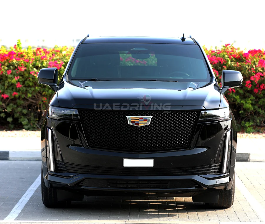 Front view of a sleek black Cadillac Escalade car showcasing its elegant design and powerful presence.