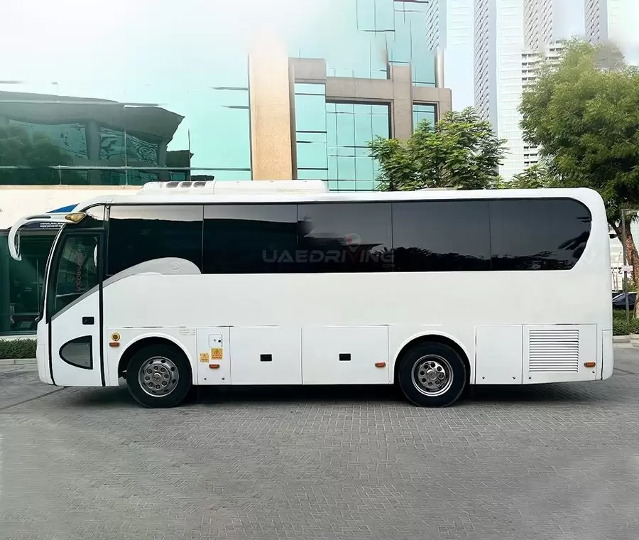 Side view of a white King Long 35 Seater bus Bus featuring tinted windows and a sleek design