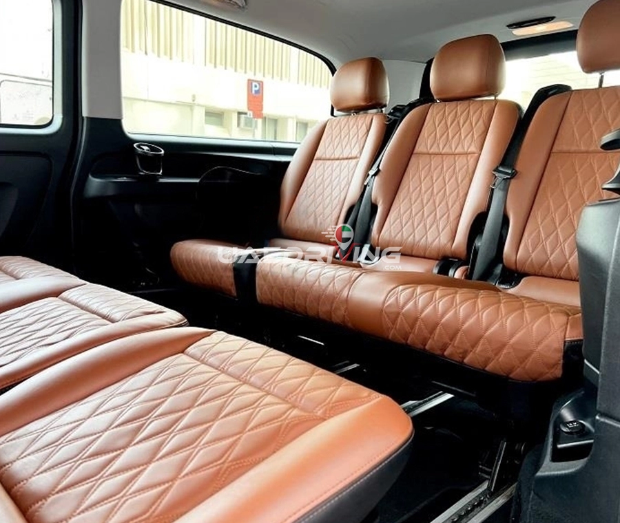 Detailed view of the interior of black Mercedes V Class car, showcasing its elegant leather seats and high-end design.