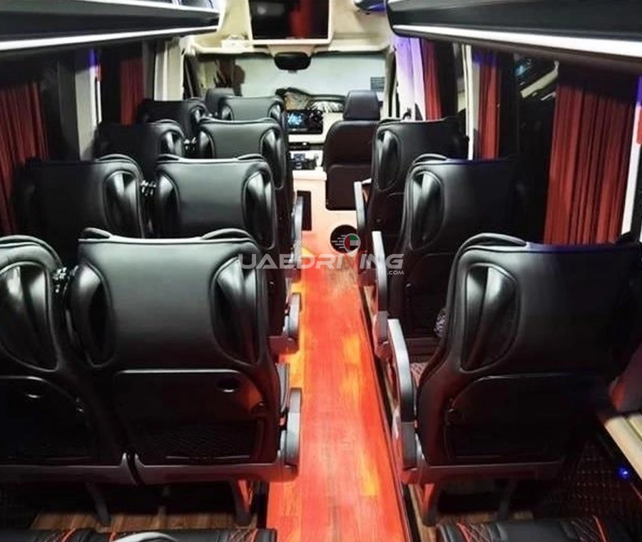 Interior of Mercedes Sprinter 19 Seater boasting sleek black leather seats and a spacious layout