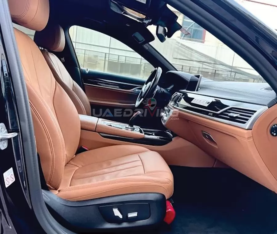 Side view image of the inside of BMW 730 Li car highlighting its modern design elements and aerodynamic contours.