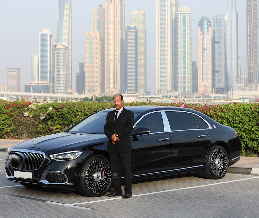 An image of Black Mercedes Benz Maybach car with private driver